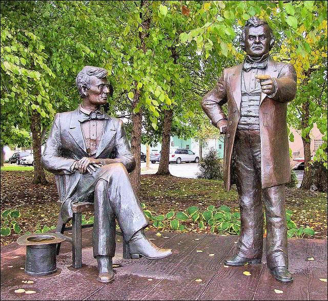Lincoln was tall and thin. He wore a baggy suit and kept his carpetbag full of notes beside him. These statues of Abraham Lincoln and Stephen A.