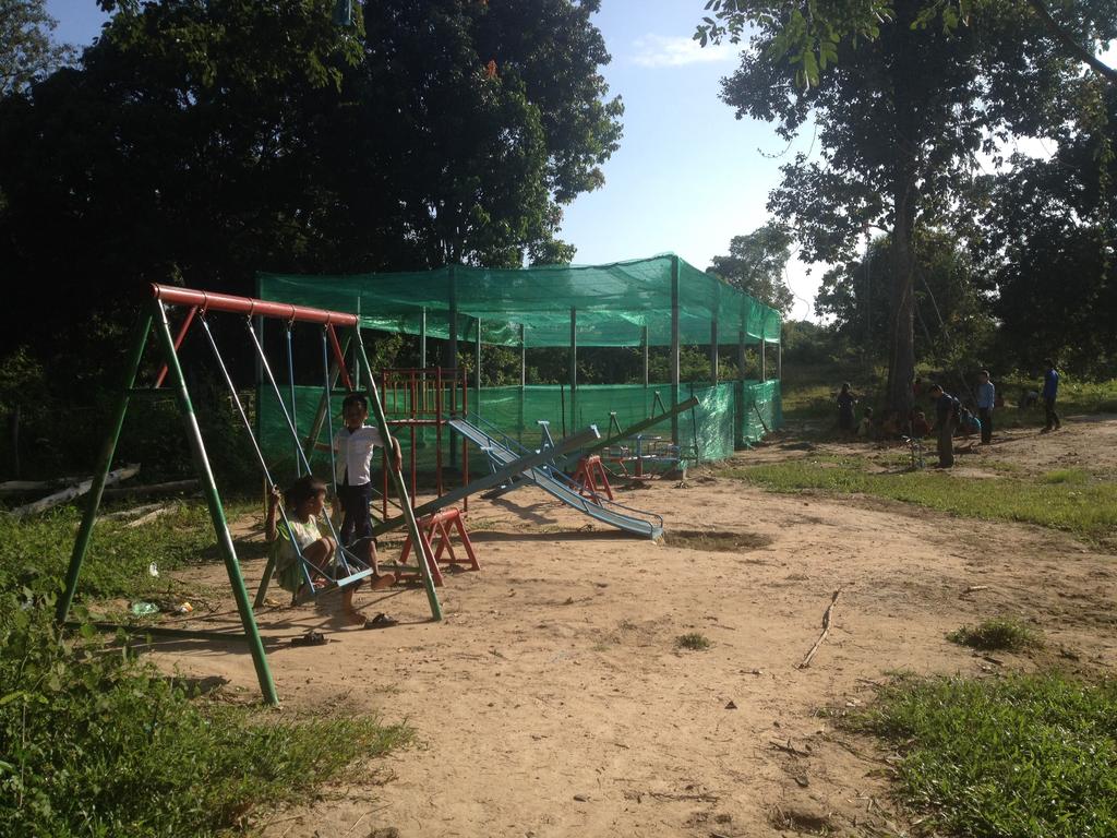 Playground and tree nursery at Anlong Thom primary school, October