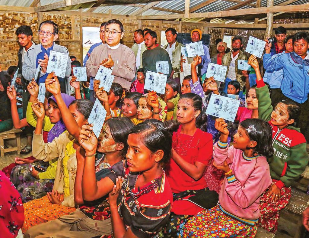 com Wednesday, 3 January 2018 Minimum wage set at Ks4,800 per day Dr. Aung Tun Thet, left, and Dr. Win Myat Aye, centre, applaud as children in Maungtaw show their National Verification Cards.