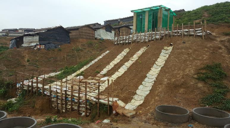 through bagging, foundation reinforcement and earthwork Ongoing repair works continue on over 300 latrines and bathing facilities damaged by rains.