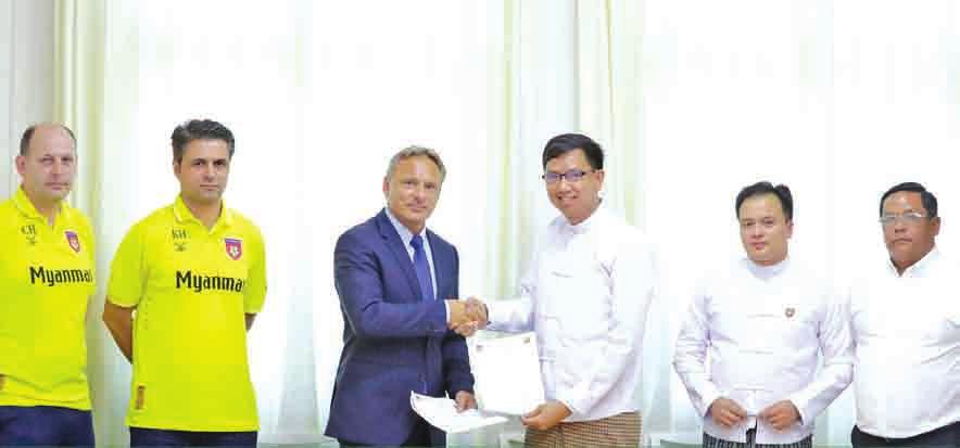 U Soe Myat Min was the interim head coach of the national team after the departure Antoine Hey (third from left) shakes hand with MFF s CEO U Bhone Naing Zaw (third from right) at the MFF office on