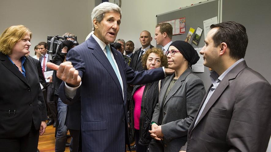 U.S. plans to accept more refugees, but security rules will limit number By Associated Press, adapted by Newsela staff on 09.24.15 Word Count 909 U.S. Secretary of State John Kerry (center) meets with refugees fleeing Syria at Villa Borsig in Berlin, Germany, Sept.