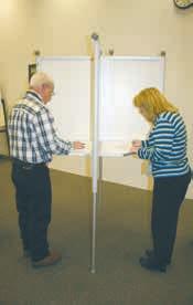 voter to place his/her ballot back in the privacy sleeve when he/she has marked the ballot.