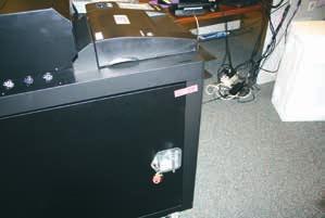 3. Remove seal from ballot box door. Ballot Box Seal The keys to open the ballot box are located around the monitor arm (see pp. 2).