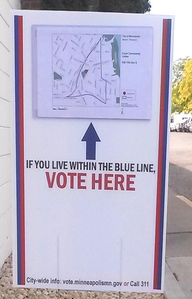 Informed signage IF YOU LIVE WITHIN THE BLUE LINE, VOTE HERE Outdoor signage displaying a precinct