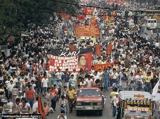 Political Demonstration in Manila Residents of Manila fill the streets during the funeral procession of leftist Philippine labor leader Rolando Olalia in 1986.