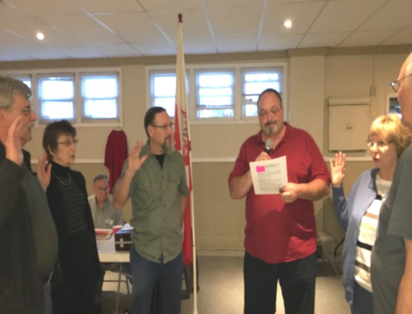 org We will add you to our email list. New member Harry Carr sworn -in by Pres.