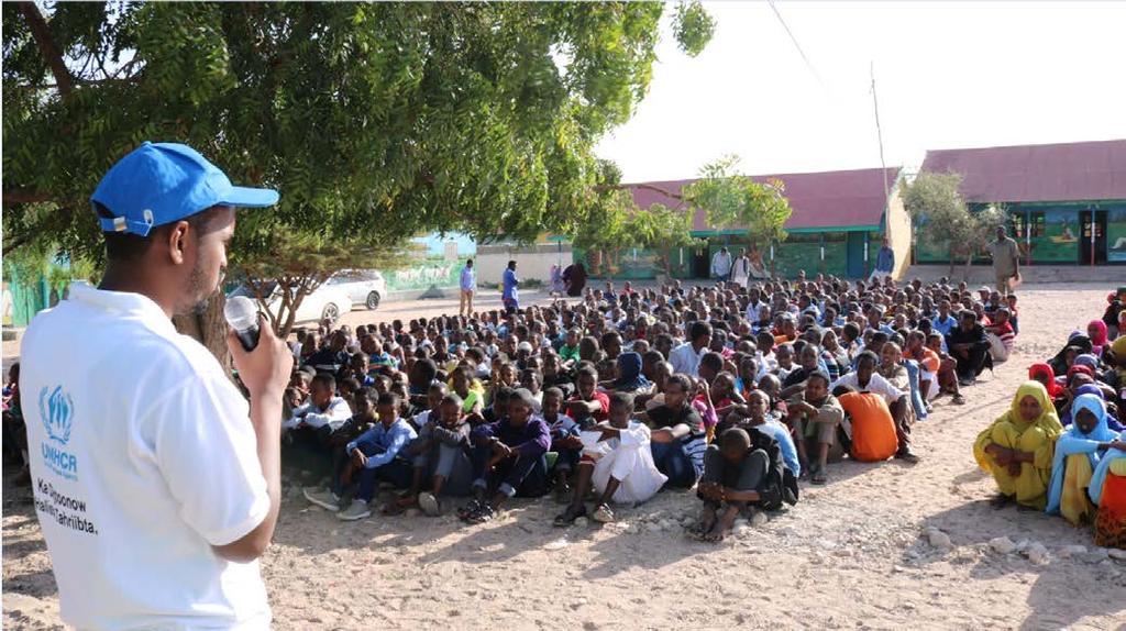 Main developments Telling the Real Story (TRS) UNHCR official talking to students at Faadumo Biixi Primary School in Hargeisa about the dangers of irregular journeys to Europe and elsewhere.