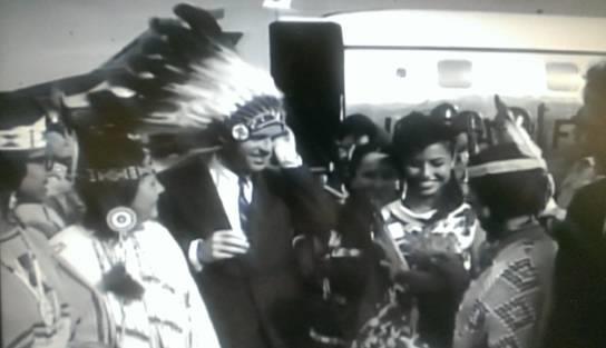 Robert Kennedy was presented with two feathered headdresses at NCAI, this one upon arrival at Bismarck airport