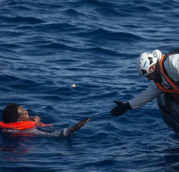 CUT ADRIFT IN THE MEDITERRANEAN Cover photo: A crew member from Migrant Offshore Aid