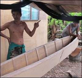 A carpenter repairs the boat of a friend with newly bought materials, Santa Fe Municipality. The International Labour Organisation report that 5.
