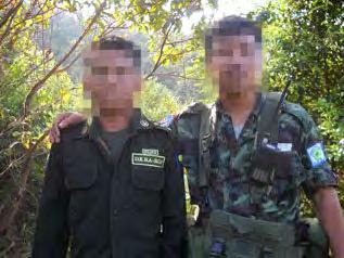 the KNLA. The photo above left shows two non-uniformed men sitting and smoking with an armed KNLA soldier in the centre.