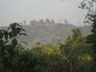 The photo above left shows a Tatmadaw camp situated on an elevated location near T--- village, which is depicted above right.