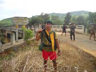 In the two photos bottom left and right, soldiers from a Karen armed group are seen crossing the bridge in
