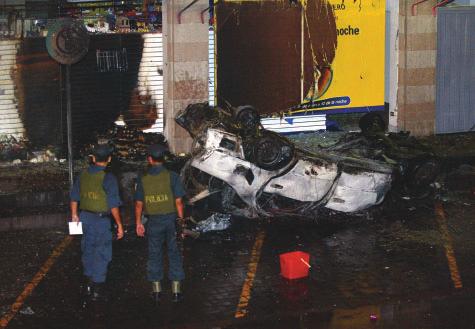 AP A damaged car on its roof after a car bomb exploded in front of the US Embassy in Lima, Peru, 21 March 2002. establishment of a financial intelligence unit (FIU).