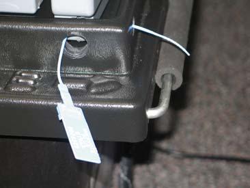 (c) Loop narrow end of strap through hole in the flat end of Cable Tie.