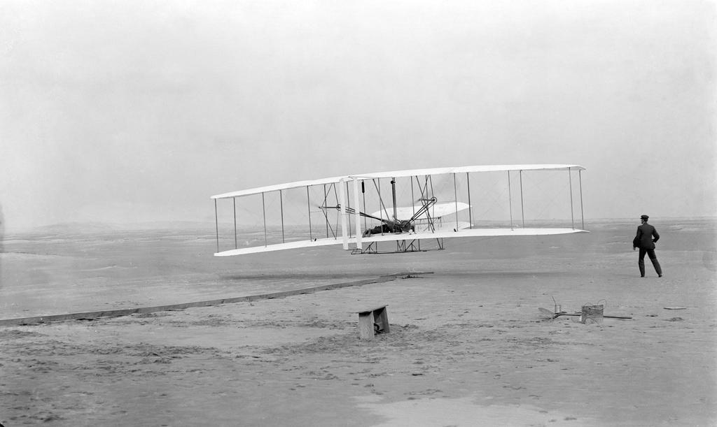 Airplanes Orville, Wilbur Wright use engines to fly heavier-than-air craft first
