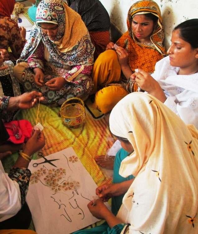 Participants perform group work during 'Decoration Piece Making Training' conducted at Ghareeb Abad, Muzaffargarh, under