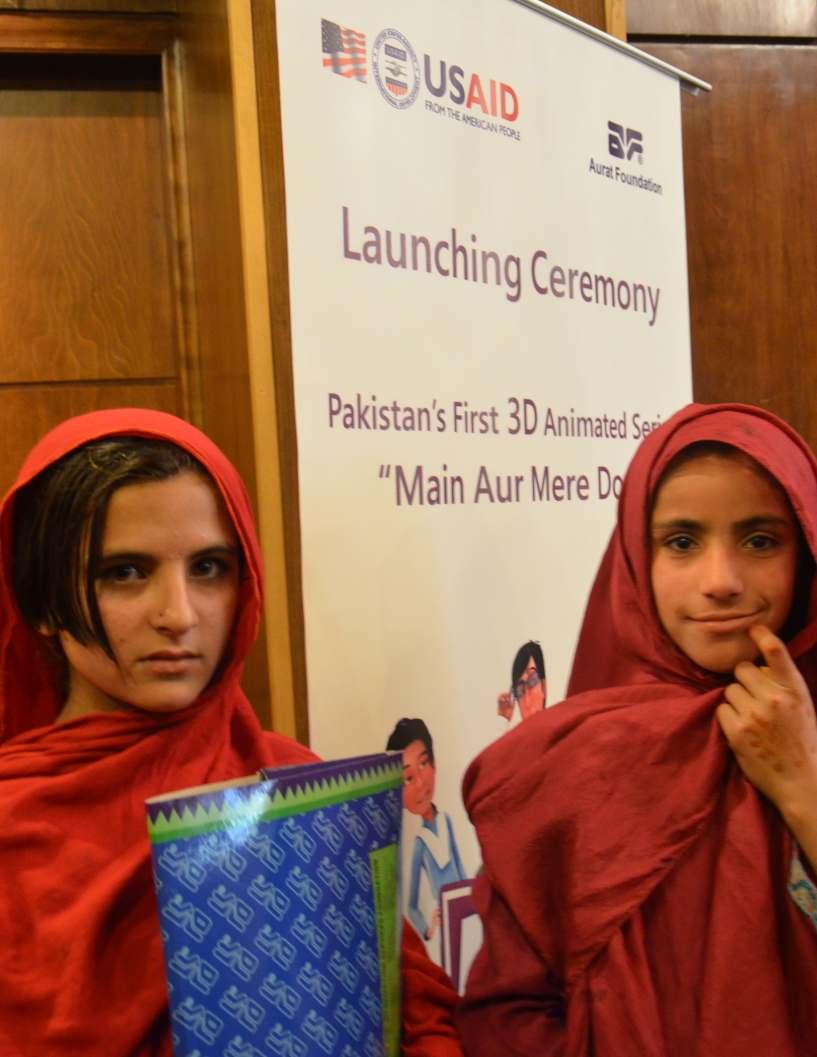 Students from Pehli Kiran School smile as they join the launching ceremony of Pakistan's