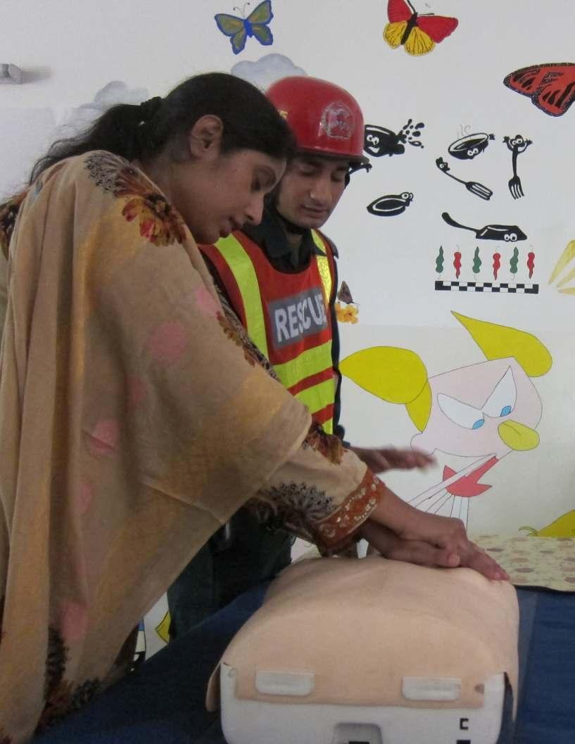 Survivors learn first aid technics at a training