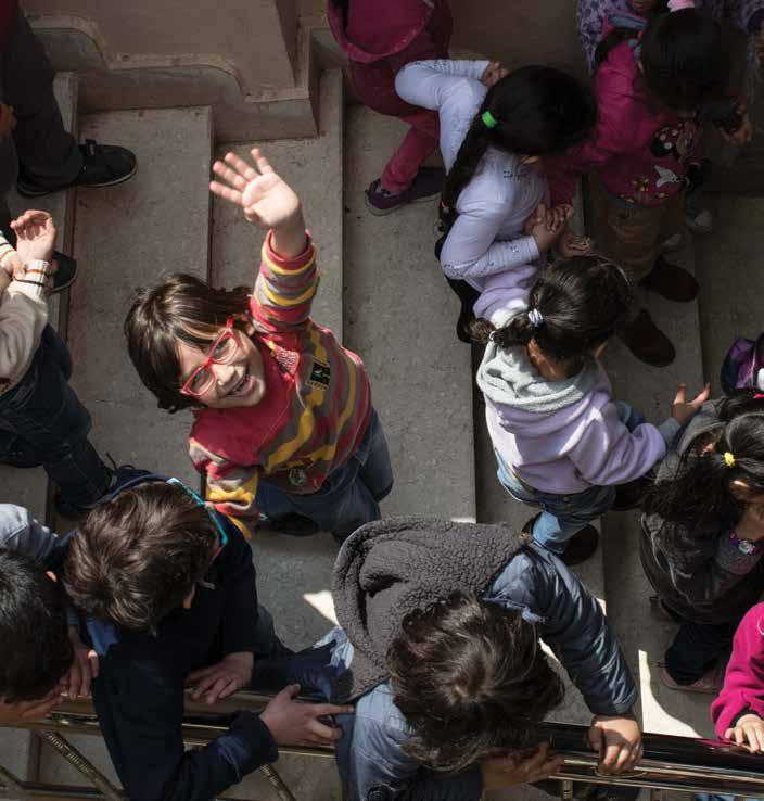 PART ONE: THE REFUGEE EDUCATION CRISIS Schools offer a pathway for improved social cohesion; a child waves on their way to class at a learning centre for Syrian refugees in Cairo, Egypt.