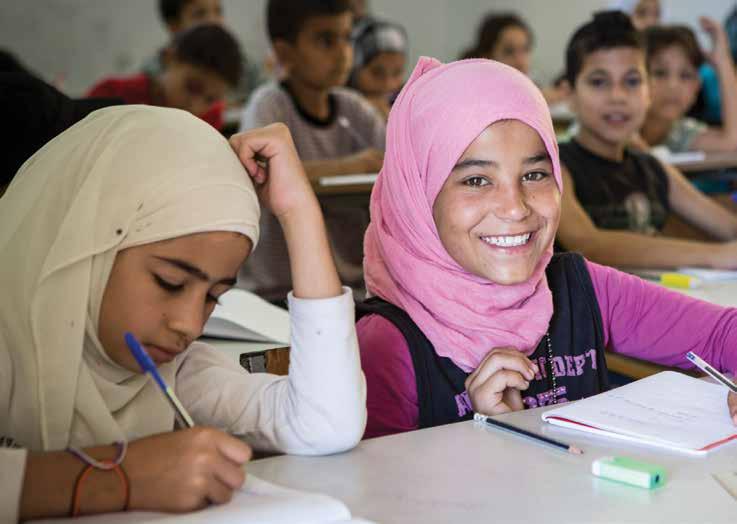 EXECUTIVE SUMMARY Syrian girls attend classes at a Save the Children supported school for refugees in Tripoli, Lebanon.