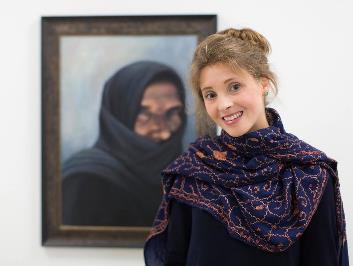 Hannah Rose with Rohingya children Hannah Rose with the portrait of a Syrian woman Hannah also travelled to Northern Iraq in summer last year, to paint Yazidi women who escaped captivity.