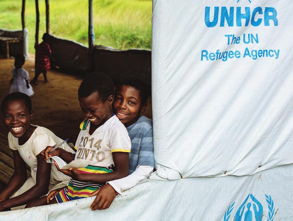 UNHCR/David Azia Ivorian refugee Tahadi (left) and her twin sister Hawae, smile as they sit with a friend in Little Wlebo refugee camp in Liberia. You saw the need. And you responded.