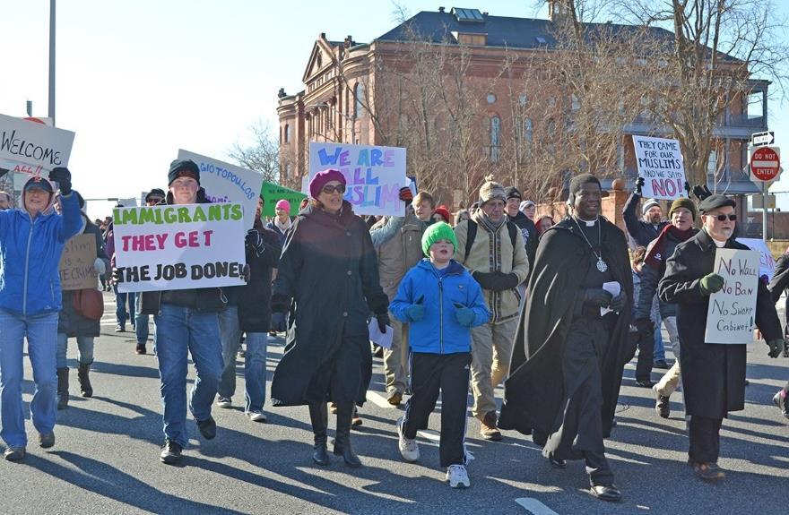 I was a stranger and you welcomed me Episcopalians Stand for Welcome: Baltimore Bishop Eugene Taylor Sutton, second from right, leads a three-mile march for refugees from downtown