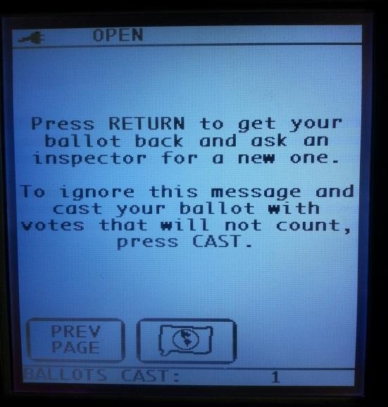 2. The machine will beep and a warning will be displayed on the LCD screen if the ballot has an Overvote, a Cross Endorsement, an Ambiguous Mark, or it is a Blank Ballot.