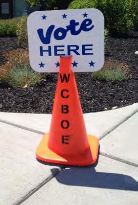 There are two blue and white Figure 6: Distance Marker Figure 5: Vote Here Sign and Vote Here Sandwich Board handicapped signs (See Figure 7) that are placed for additional handicapped parking places.