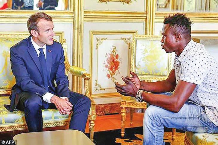 12 WORLD Hero Malian who saved child to get French citizenship PARIS A Malian migrant who saved a four-yearoldchild hanging from a fourth-floor Paris balcony after scaling the building with his bare
