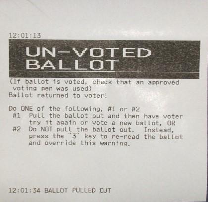 If Voter insists on voting OVER-VOTED Ballot, move to the rear of the Scanner where an opening will display the number 3 on the keypad. 4. Press 3 while inserting Ballot. 5.