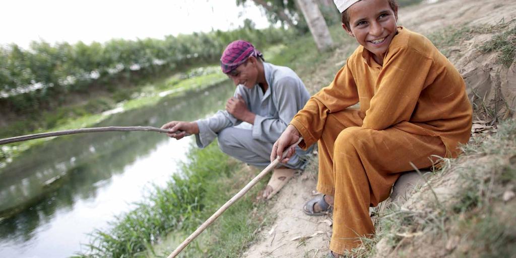 Photo:Two orphaned boys fishing in their village in Khyber Pakhtunkhwa, Pakistan, where Islamic Relief rebuilt many homes after the 2010 floods.