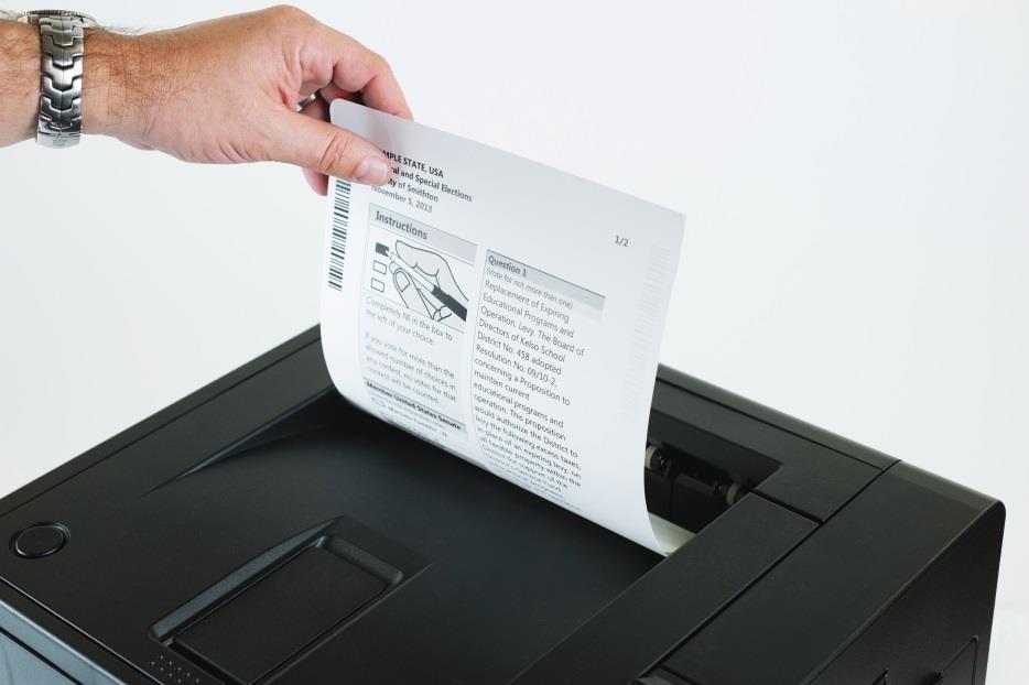 print ballot After reviewing and confirming their choices, the voter will choose Print Ballot The voter retrieves the printed ballot from the laser printer next to their device (all are double sided).