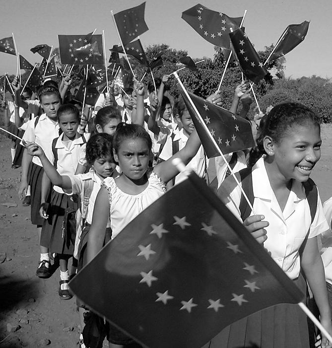 Nicaraguan primary school pupils waving EU flags. Nicaragua is a major recipient of EU development funding in Latin America. Photo: EuropeAid.