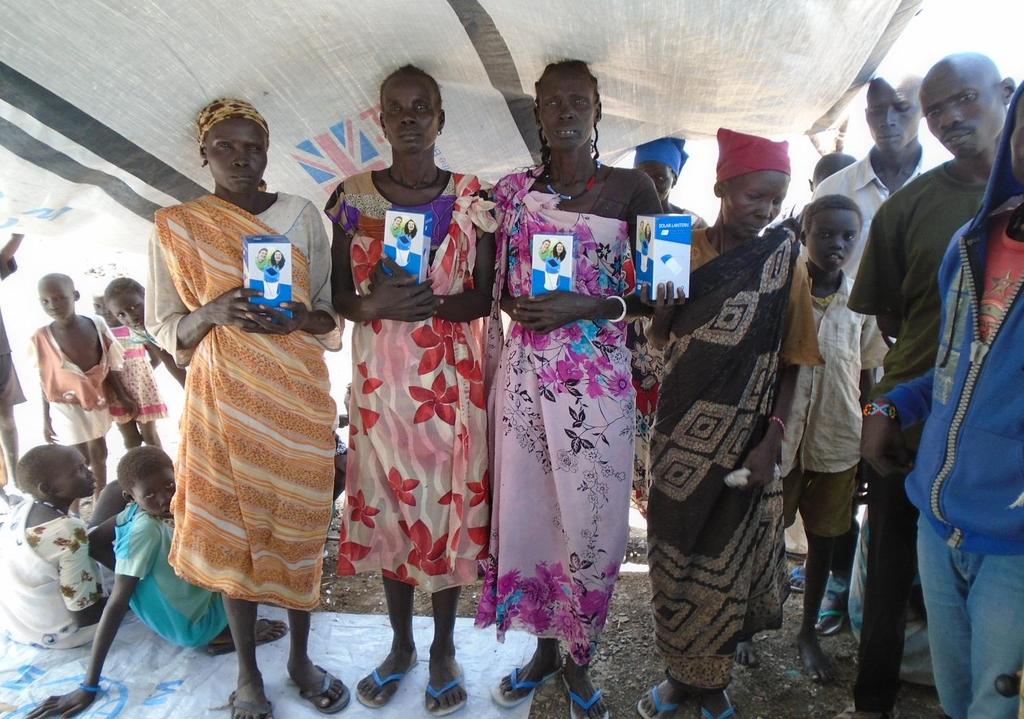 Photo 4: Group of the FHH beneficiaries who received solar lamps in the first day