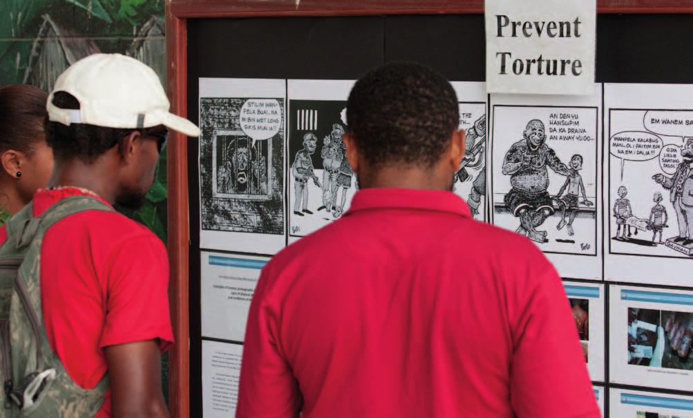 COMBATING IMPUNITY AND STRENGTHENING ACCOUNTABILITY AND THE RULE OF LAW OHCHR Photo/Ness Kerton Participants look at an exhibition on torture organized by OHCHR in Papua New Guinea.