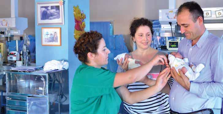 Two premature newborns parents benefiting from medical advice at Koço Gliozheni maternity hospital in Tirana own health.