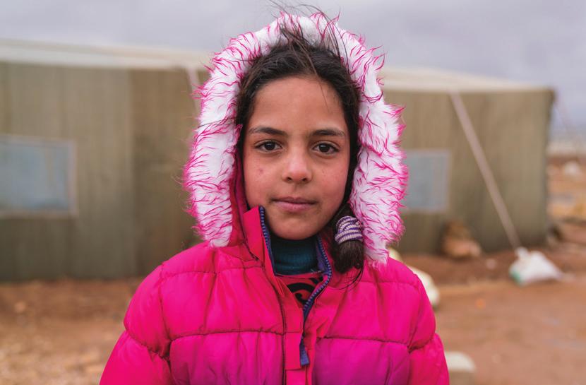 MAIN DRIVERS OF HUMANITARIAN NEEDS Main drivers of humanitarian needs AMMAN, JORDAN Syrian refugee Arkan, 10, stands outside the Makani Centre, run by the Islamic Charity Center Society (ICCS), a