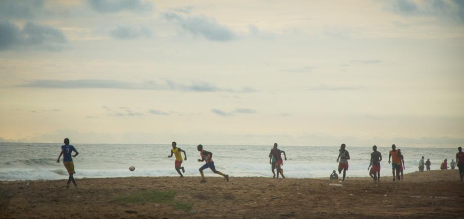 Children play a game of soccer on the beach in Monrovia.