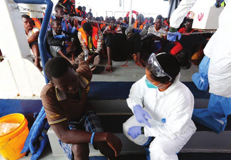 Image 11: A migrant receiving medical attention after being rescued in the Central Mediterranean (MOAS.
