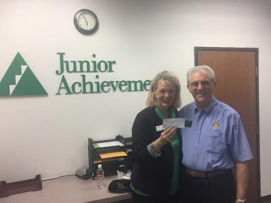 Page 3 Club Donates To Junior Achievement President Tony hands Dena Kidd a check for $2000 from our club Late last month, President Tony met with Dena Kidd at the Junior Achievement open house.
