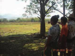 In the photo at right, all three villagers are indicating an area near Thee Wah village that continues to be contaminated by mines.