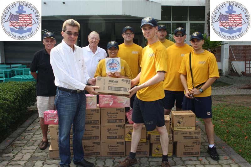 Project Handclasp: The USS Dewey brought an estimated Baht 20,000 worth of Project Handclasp goods with them to turn over to the Rotary International District 3330 for the Thai floods occurring north