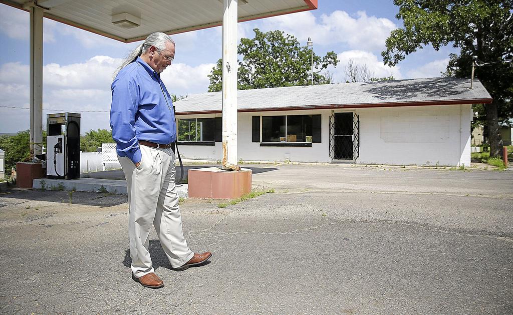 Carl Kelley stands at the store where his father was murdered. He was just a good, blue-collar worker. Went to church every Sunday raised his family and provided a good home, Kelley said.