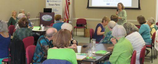 Animated and focused conversation of the members of five LWVHC Table groups wove