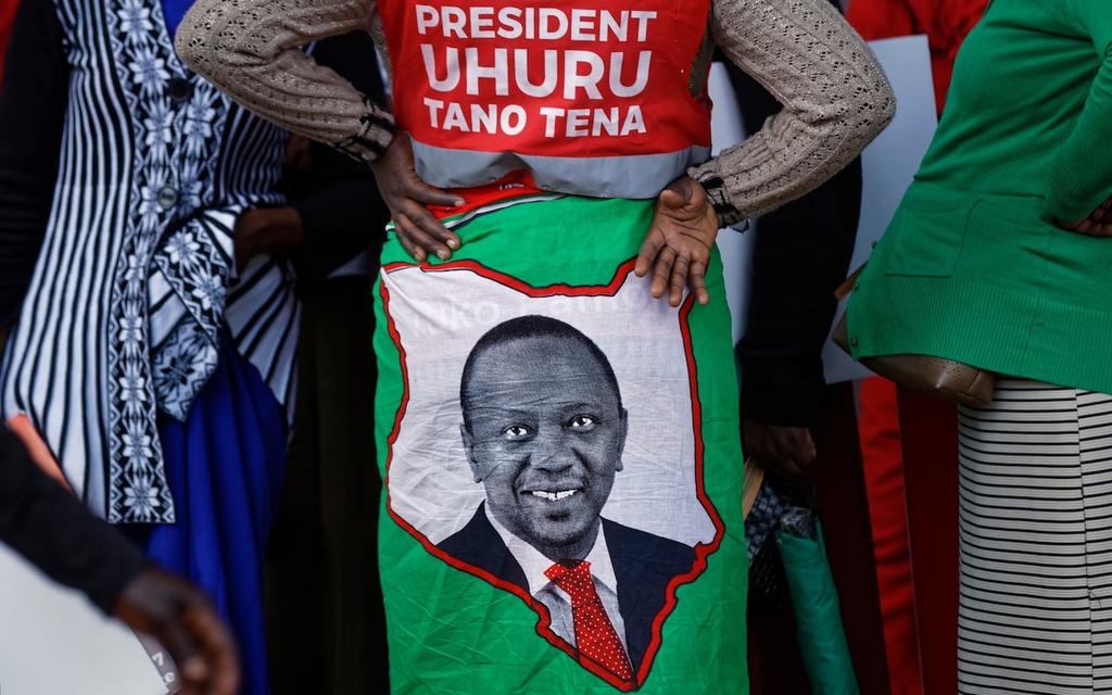 A supporter wears a cloth wrap showing Kenya s incumbent President Uhuru Kenyatta Credit: AP But many worry what the human cost of such a massive show of force