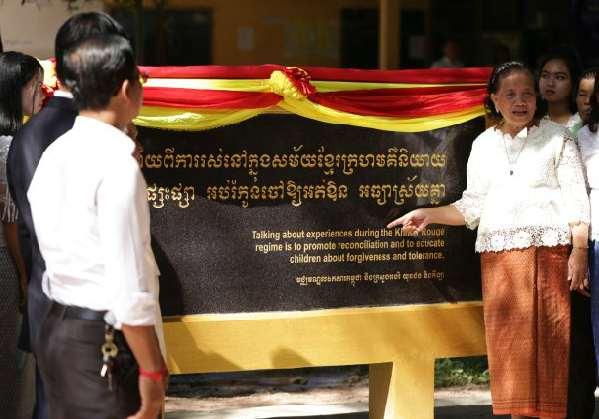 Cambodia Introduction *Her Excellency Ton Sa-Im explaining the importance of the slogans during the unveiling of the Genocide education memorial The Documentation