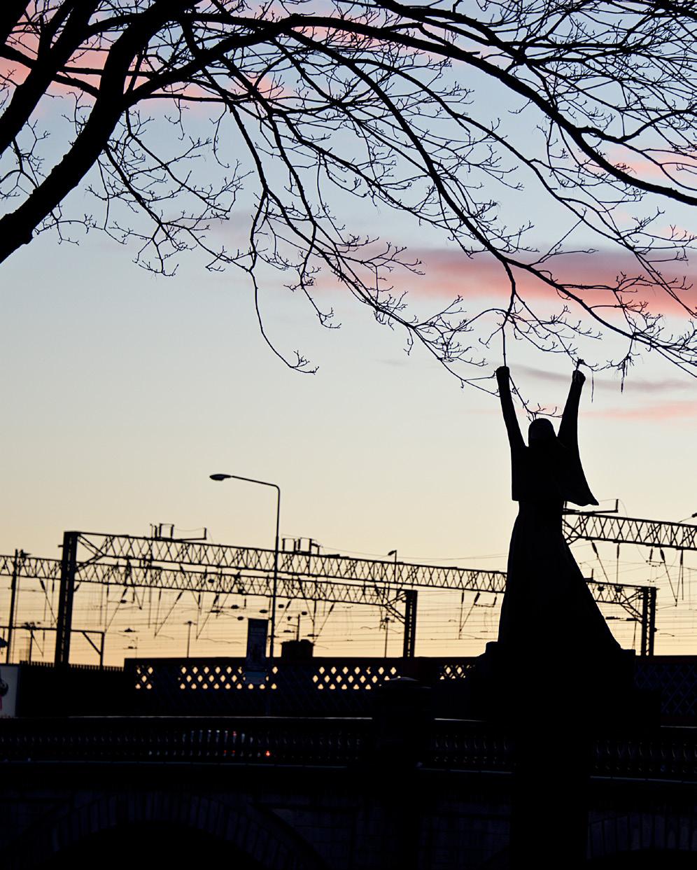 Cover image: Sunset creating silhouette of the statue La Pasionaria in Glasgow.